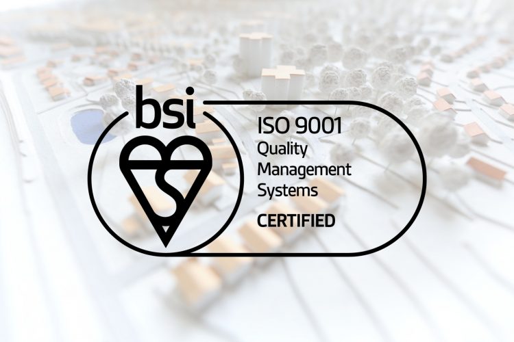 the ISO 9001 quality management systems logo sits in front of a town map