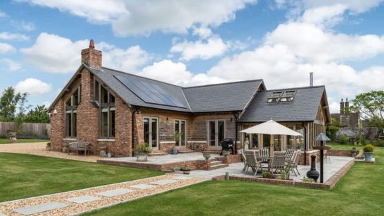 Stunning brick self build home in a lovely garden with lawn to the front